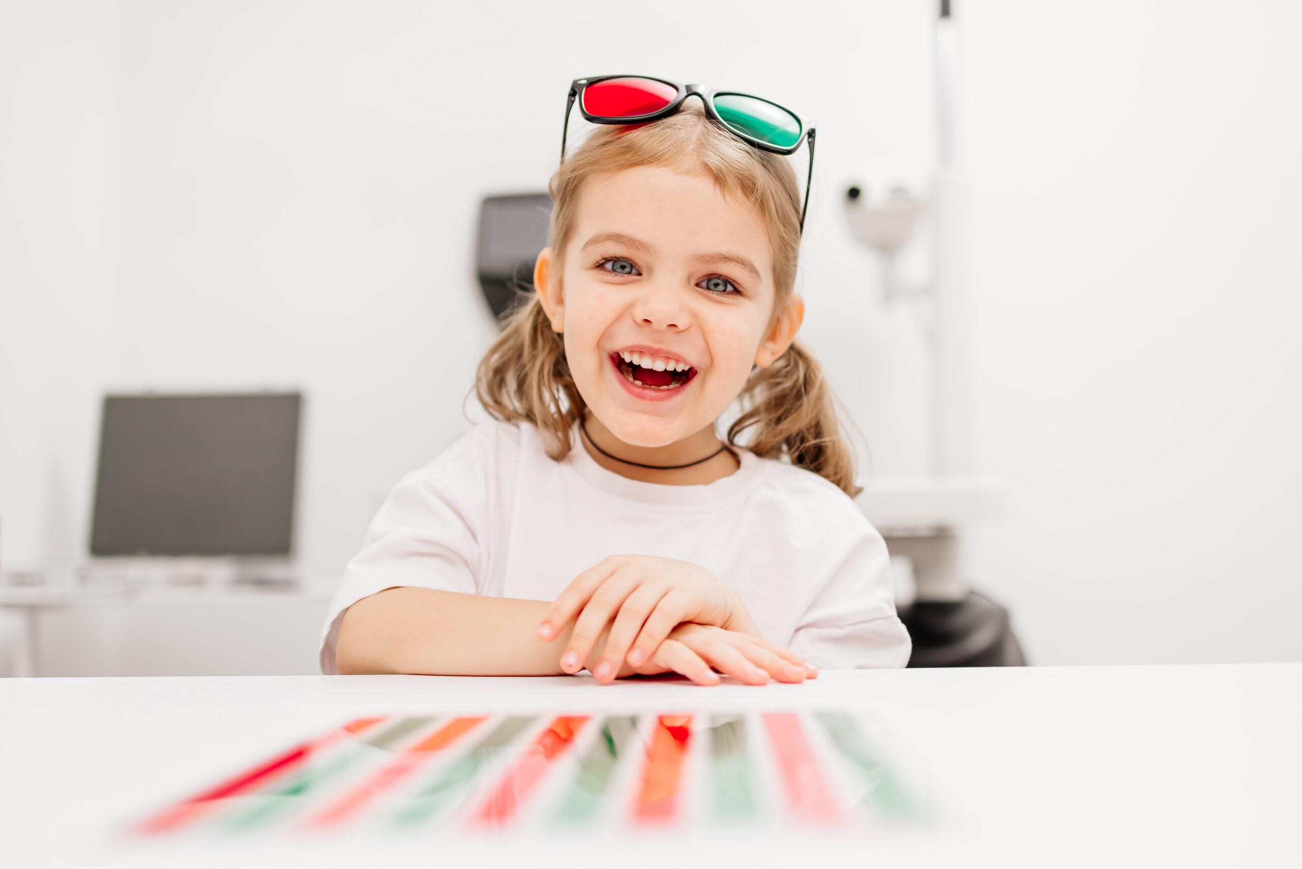 A modern approach to orthoptic therapy for comfortable vision treatment in children. A cheerful girl wearing vision stimulation glasses highlights the importance of an engaging restoration process.
